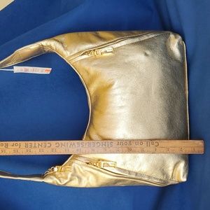 Pinky bag new with tags in genuine leather gold foil. I have 5 bags in stock